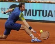 Andy Murray returns the ball to Florian Mayer in Madrid on May 7, 2013